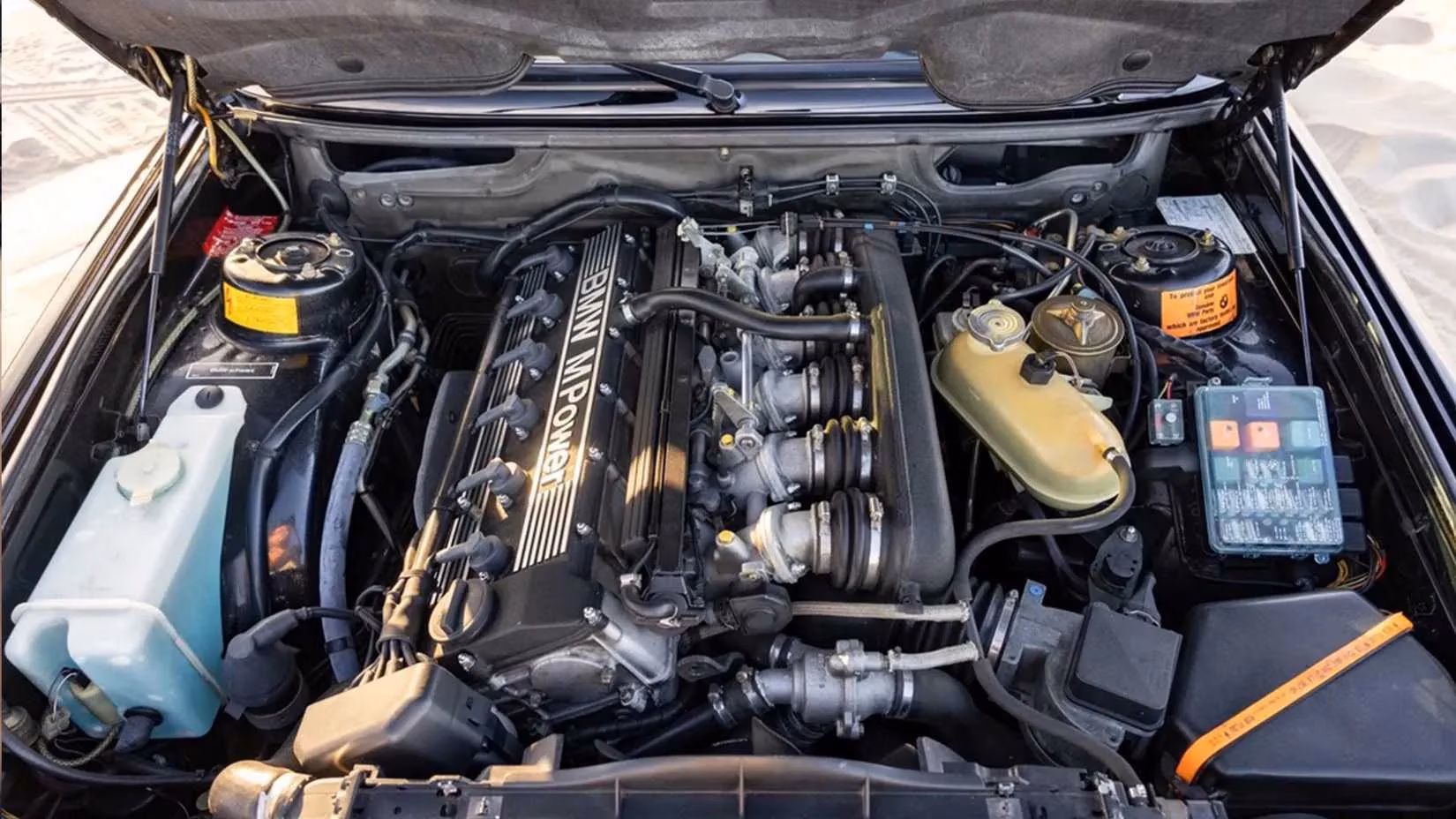 the-genesis-of-a-genre-how-the-1984-bmw-e28-m5-redefined-the-luxury-sports-sedan-image-1